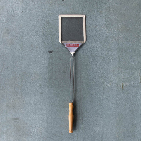 Wire mesh fly swat with cotton webbing surround. Steel and turned timber handle for generous reach and strength. 