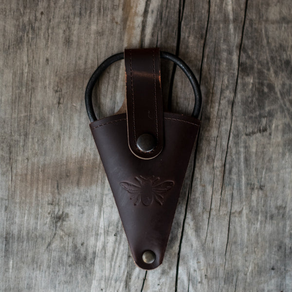 Keep metal herb or flower scissors handy, stored in a recycled leather pouch threaded onto your belt or apron tie. Perfect for snipping herbs for the night's dinner, or light stems of flowers. 