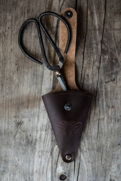 Keep metal herb or flower scissors handy, stored in a recycled leather pouch threaded onto your belt or apron tie. Perfect for snipping herbs for the night's dinner, or light stems of flowers. 