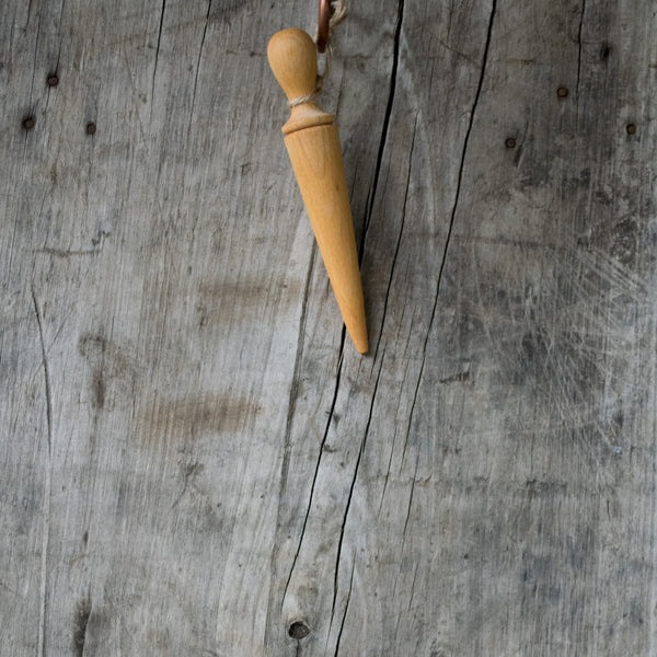 Oak mini dibber for making indentations in the soil for planting seeds, seedlings and bulbs.