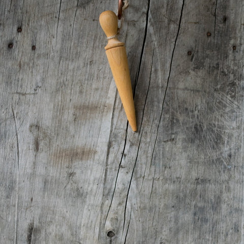 Oak mini dibber for making indentations in the soil for planting seeds, seedlings and bulbs.