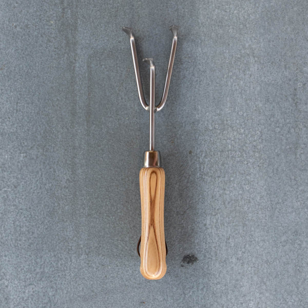An essential Hand Cultivator, polished stainless steel and certified FSC ash handle. Ideal for cultivating the soil surface for planting and weed removal. 