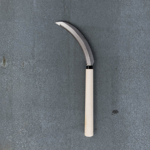 Hand Sickle, with a curved, serrated 18cm carbon steel blade and 20cm timber handle. A multi-purpose tool for harvesting vegetables and cutting grass.