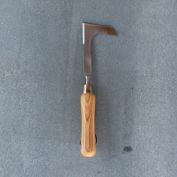 An essential Weeding Knife, polished stainless steel and certified FSC ash handle. Ideal for weeding and digging deep in the cracks and joins of pavement, reaching beneath rocks, and lifting out weeds by the roots.