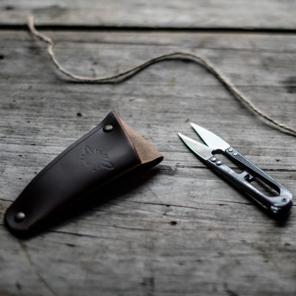 Keep metal gardening snips or small shears handy, stored in a recycled leather pouch threaded onto your belt or apron tie. Perfect for snipping herbs and vegetables for the night's dinner, light deadheading spent flowers or pruning.