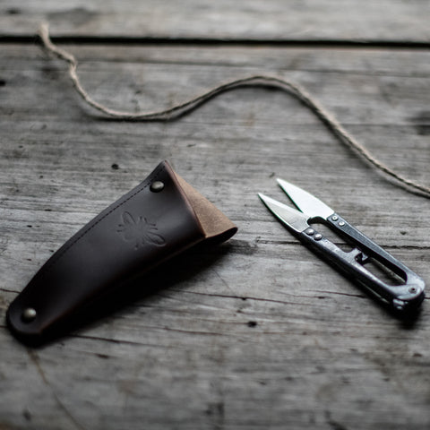 Keep metal gardening snips or small shears handy, stored in a recycled leather pouch threaded onto your belt or apron tie. Perfect for snipping herbs and vegetables for the night's dinner, light deadheading spent flowers or pruning.