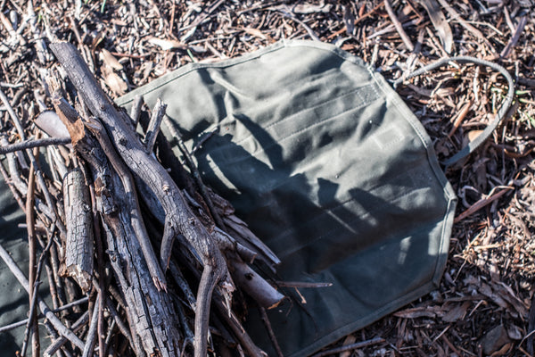 Use our waxed canvas log carrier to make lighter work of collecting kindling or logs for wood fires at home or while camping. It also doubles as a flower and foliage carrier when foraging.