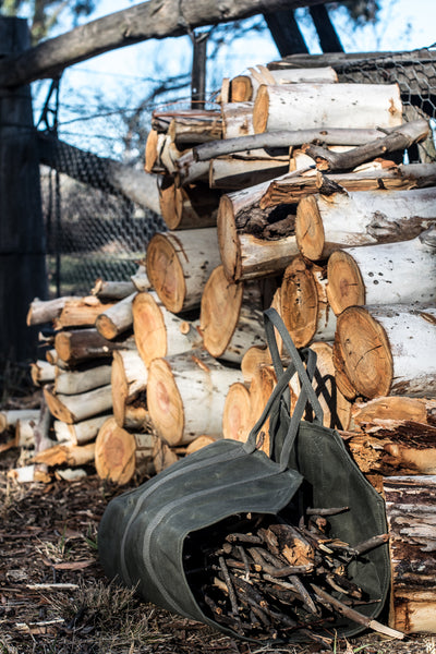 Use our waxed canvas log carrier to make lighter work of collecting kindling or logs for wood fires at home or while camping. It also doubles as a flower and foliage carrier when foraging.