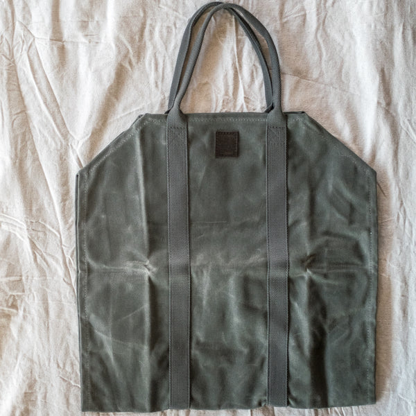 Use our waxed canvas log carrier to make lighter work of collecting kindling or logs for wood fires at home or while camping. It also doubles as a flower and foliage carrier when foraging.