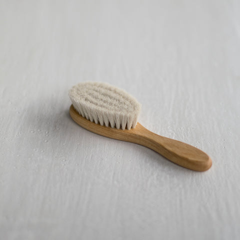 Baby hair brush handmade of the softest goat hair and oiled beechwood timber.