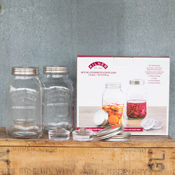 Kilner Fermentation Set to make small batches of sauerkraut, kimchi, pickles and more. The Kilner Fermentation Set includes 2 x 1 litre Kilner Preserving Jars, 2 x Silicone Steel Lids with Silicone Air Lock Valve, 2 x Silicone Rings, 2 x Lids, 2 x glass weights, and 1 x Recipe Booklet.