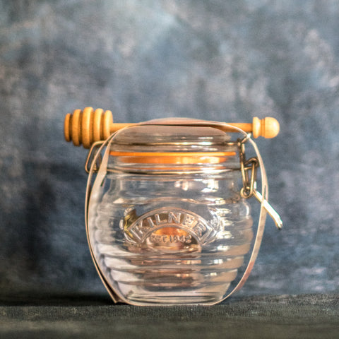 Decant your honey or maple syrup into a Kilner Honey Pot and Drizzler Spoon, or even better find a honey retailer or beekeeper who will bottle honey into your reusable jar.