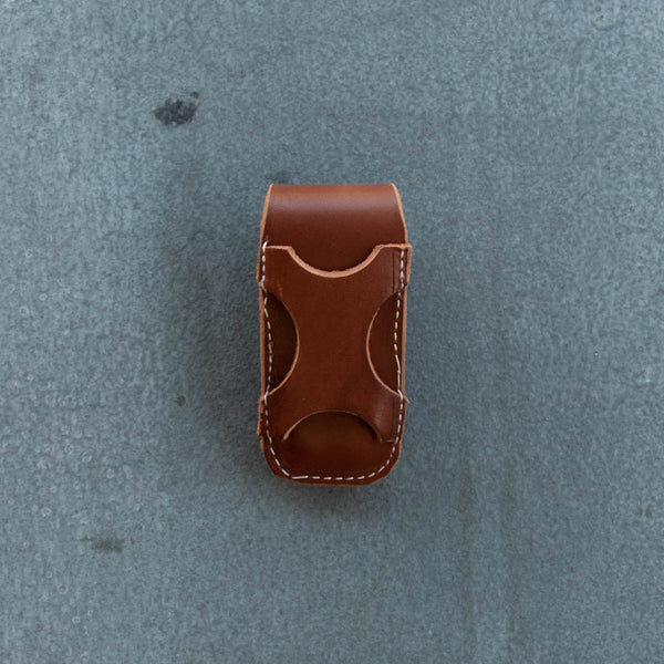 Sturdy leather knife pouch for threading through a belt, side and vertical mount position. Suits Leatherman Wave. Dimensions length 13 cm, width 6 cm. Locally made near Nundle, NSW, Australia.