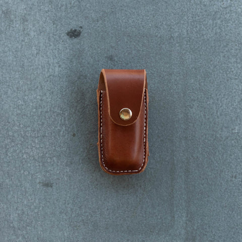 Sturdy leather knife pouch for threading through a belt, side and vertical mount position. Suits Leatherman Wave. Dimensions length 13 cm, width 6 cm. Locally made near Nundle, NSW, Australia.