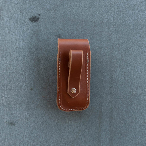 Sturdy leather knife pouch for threading through a belt, vertical mount. Suits Leatherman Wave. 