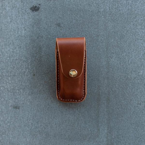 Sturdy leather knife pouch for threading through a belt, vertical mount. Suits Leatherman Wave. 