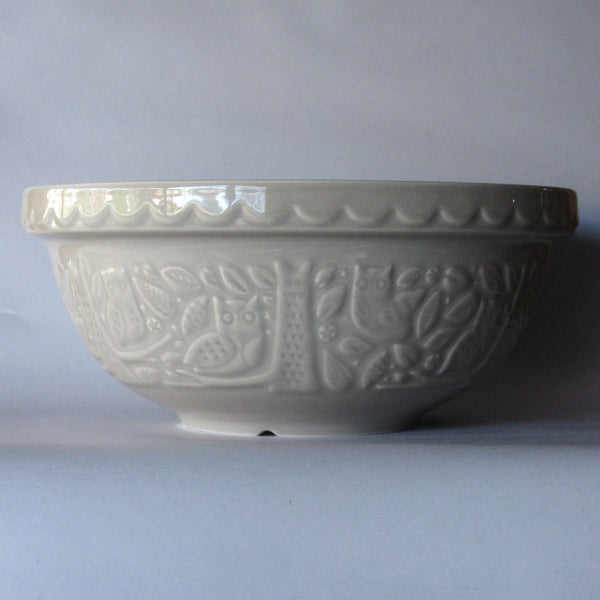 Enjoy the tradition of using a Mason Cash ceramic mixing bowl, with an In the Forest woodland owl pattern, stone colour exterior, and cream interior. 