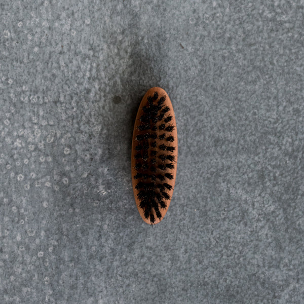 Beard Brush for keeping facial hair well-groomed.