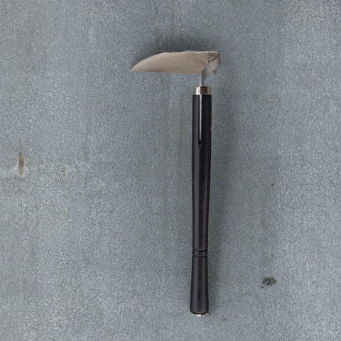 Nisaku Nejiri Bent Neck Sickle is a traditional Japanese garden tool with an extra sharp bottom edge to use as a draw hoe for weeding.