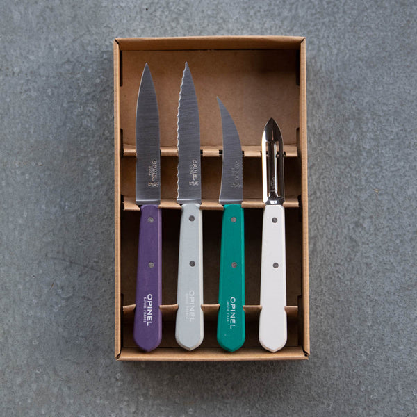 Opinel's kitchen essentials set with stainless steel blades, available in Art Deco colourway handles. The set includes a peeler and three knives for prepping food in the kitchen; a paring knife no. 112, serrated knife no. 113, vegetable knife no. 114, and peeler no. 115. Dishwasher safe.