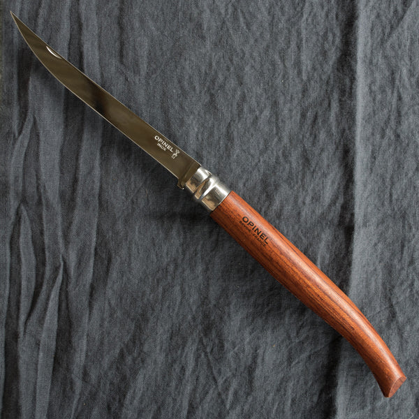 An Opinel fish filleting pocket knife with slimline polished stainless steel blade and Padauk handle. Available in four sizes 8cm, 10cm, 12cm, and 15cm. Made in France since 1890, Opinel knives are reliable, robust and easy to use.