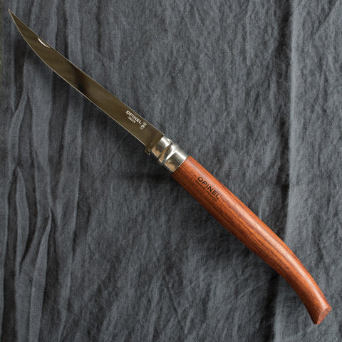 An Opinel fish filleting pocket knife with slimline polished stainless steel blade and Padauk handle. Available in four sizes 8cm, 10cm, 12cm, and 15cm. Made in France since 1890, Opinel knives are reliable, robust and easy to use.