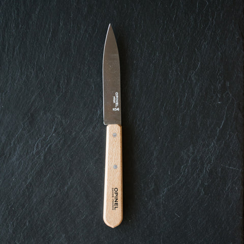 A useful and beautiful gift for the cook, Opinel's kitchen essentials beechwood 10cm paring knife no. 112 with pointed smooth stainless steel blade for cutting, slicing and peeling fruit and vegetables and for trimming meat.
