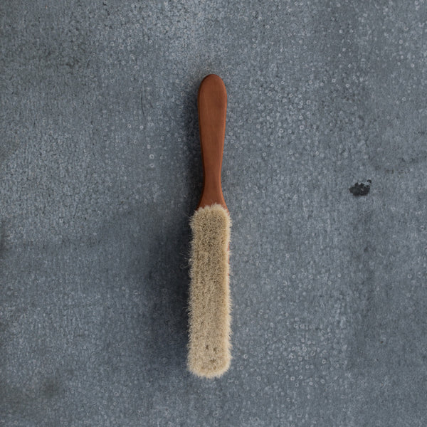Duster made from goat hair and pearwood. Enjoy the artisan quality of the soft goat hair and slender, warm coloured, pearwood timber handle duster for reaching into narrow spaces.