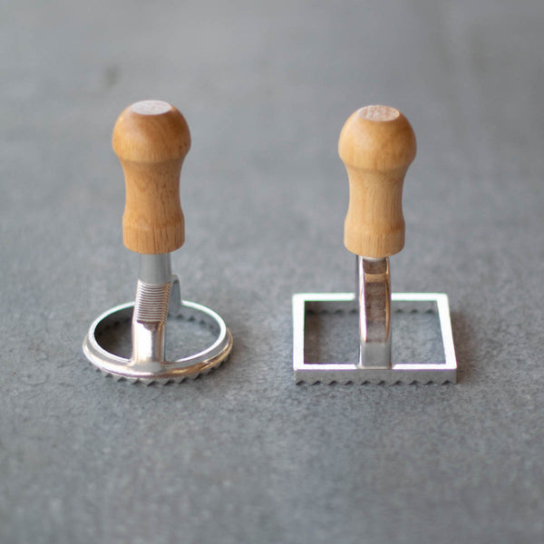 Use our set of two ravioli cutters to create homemade ravioli. Make and roll out a pasta dough using a pasta roller or rolling pin and cut round or square ravioli shapes before adding filling, cooking and serving with sauce.