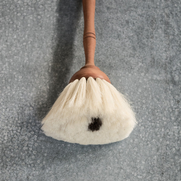 The Redecker goat hair duster catches everyone's eye in the shop. With a waxed pear wood turned timber handle and dust brush made from the softest black goat hair the duster elevates a banal task to an enjoyable one.