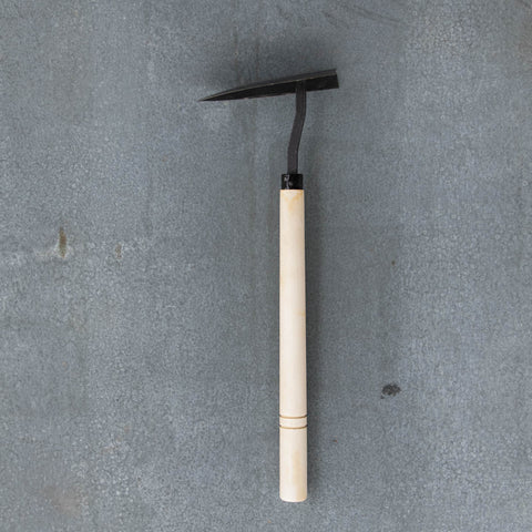 Delta Hoe, with pointed and weighted carbon steel head, for scraping off and removing surface weeds, digging and making rows for planting, and tilling soil.