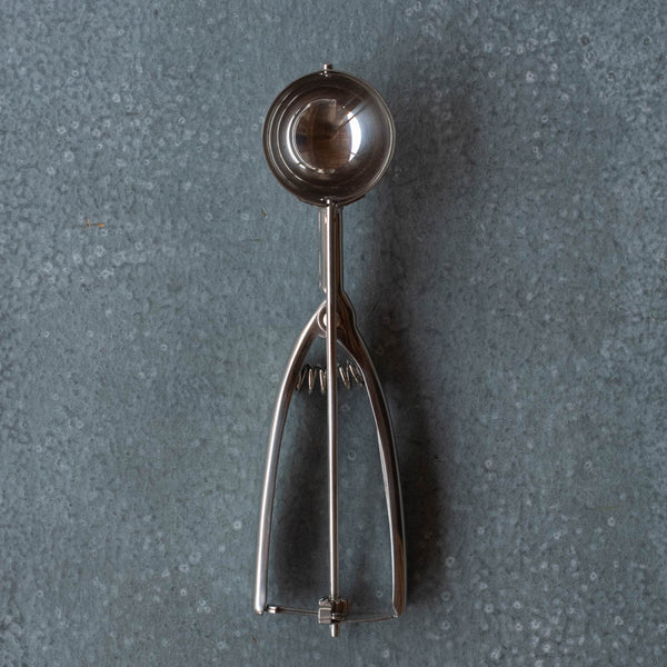 There's great joy in the simple lever action of the old-fashioned stainless steel ice cream scoop. It is one of our best sellers. Maybe because the scoop mechanism makes it easy to serve your favourite ice cream. Or everyone wants to use them to evenly distribute cup cake batter.