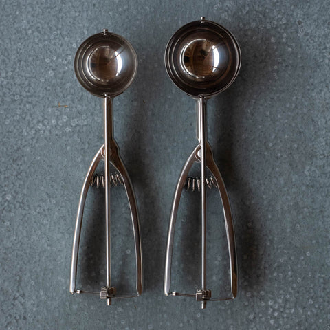 There's great joy in the simple lever action of the old-fashioned stainless steel ice cream scoop. It is one of our best sellers. Maybe because the scoop mechanism makes it easy to serve your favourite ice cream. Or everyone wants to use them to evenly distribute cup cake batter.