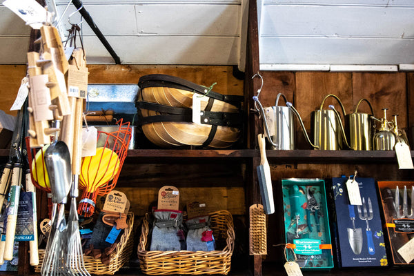 Garden wares displayed on recycled packing shelving at Odgers and McClelland Exchange Stores, Nundle, NSW.