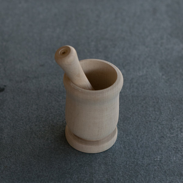 Enjoy the simplicity of this beech timber mortar and pestle for grinding spices and making cooking pastes. The mortar and pestle has the advantage of having a small footprint and is remarkably light. Hand wash with soap and water. Unfinished wood will patina with use.