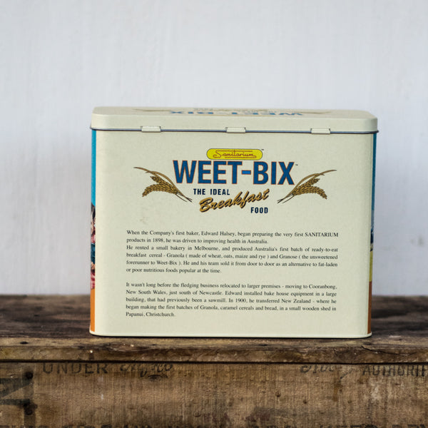 Weet-Bix tin for convenient storage, featuring an original retro Sanitarium design, to protect your cereal from ants and other kitchen pests. Hinged lid.