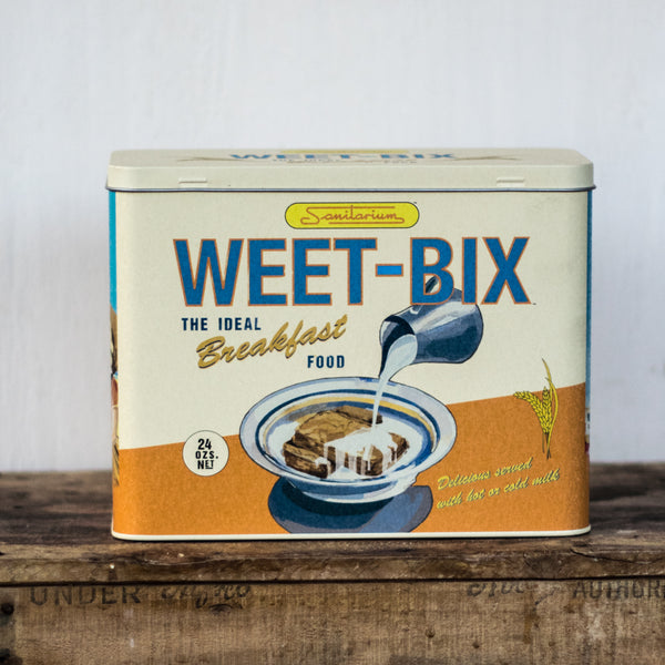 Weet-Bix tin for convenient storage, featuring an original retro Sanitarium design, to protect your cereal from ants and other kitchen pests. Hinged lid.